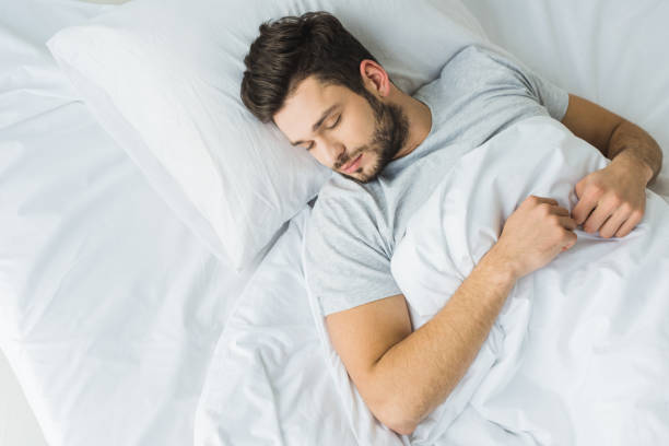 istock top view of bearded man sleeping on bed 936413512