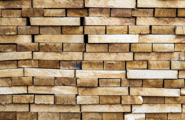 istock Wood timber construction material background and texture. Stack of lumber,Natural wooden background. 936415200