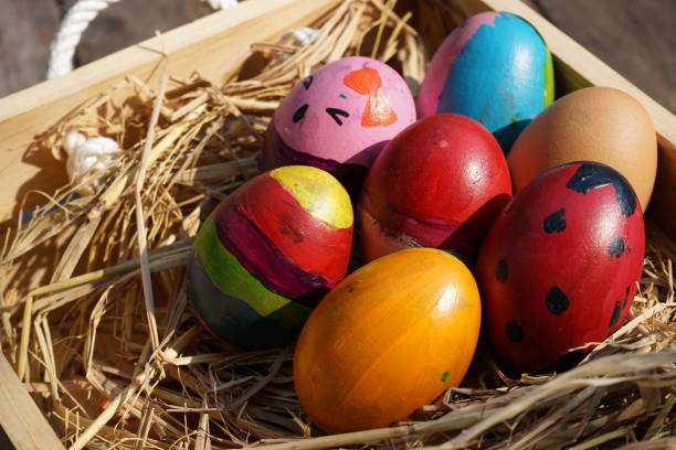 istock Colorful fancy easter eggs in wooden box 936415862