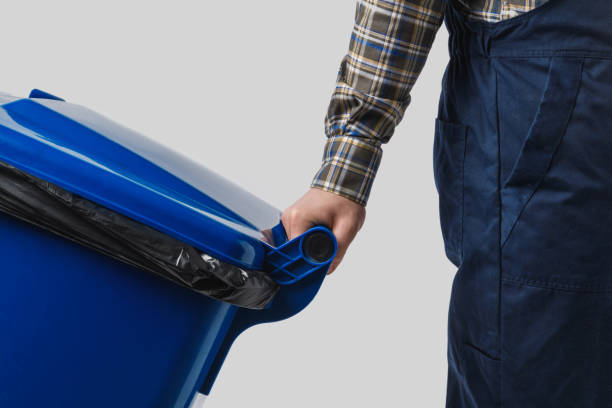istock partial view of cleaner with trash bin isolated on grey 936417608