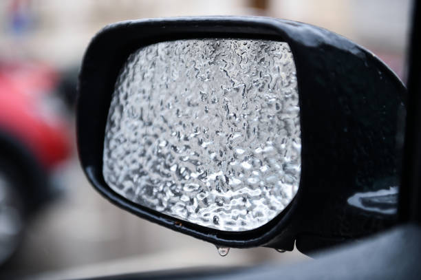 istock Car mirror covered in ice during freezing rain phenomenon 936417888