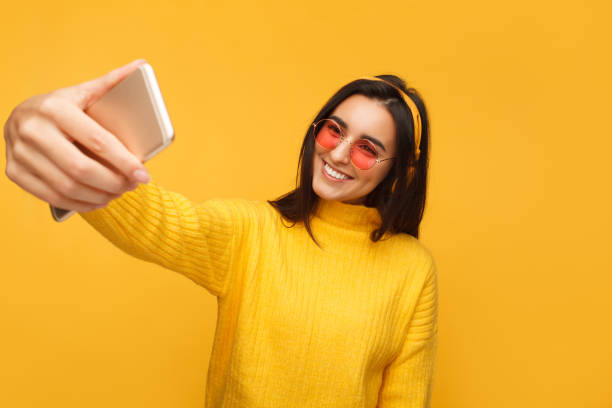 istock Charming hipster girl taking selfie 936419908