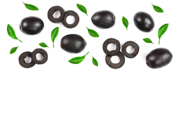 istock whole and sliced black olives isolated on white background with copy space for your text. Top view. Flat lay pattern 936420070