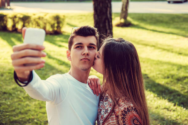 istock Young man doing selfie with his girlfriend. sunny day 936421332