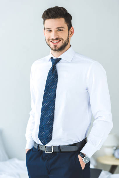 istock handsome smiling businessman in white shirt and tie 936425002