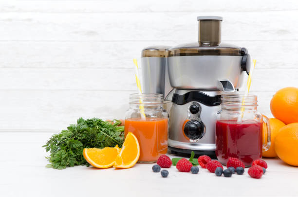 istock Preparing juice from fresh fruits and vegetables 936427438