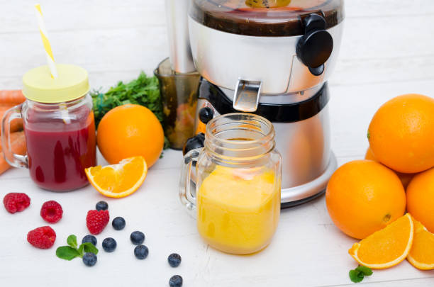 istock Preparing juice from fresh fruits and vegetables 936427496