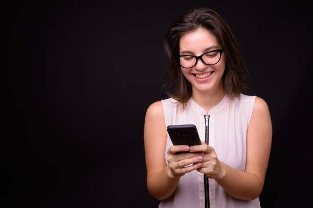 istock Portrait Of Young Woman Text Messaging 936430956