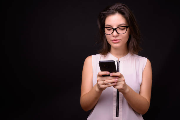 istock Portrait Of Young Woman Text Messaging 936430972