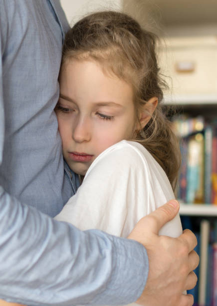 istock Sad little girl hugging her dad. 936433646