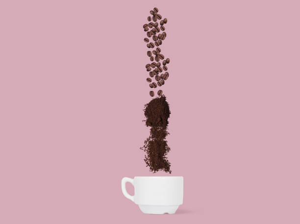istock Coffee beans and ground coffee fall into the cup. ConceptCoffee beans and ground coffee fall into the cup. 936435690