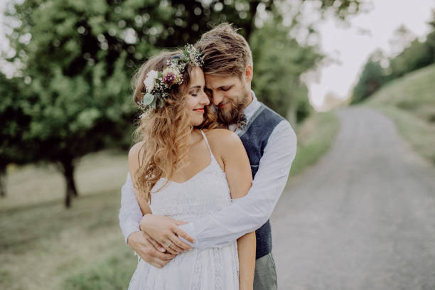 istock Beautiful bride and groom in green nature. 936436040