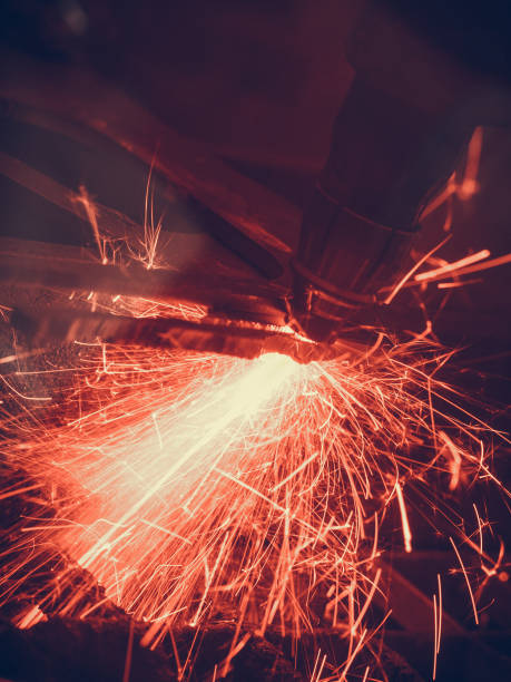 istock Laser cutting steel metal with bright sparks 936436598