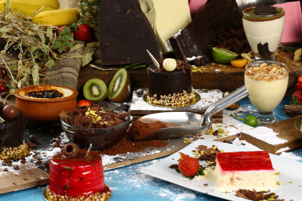 istock Table with various cookies, tarts, cakes, cupcakes and cakepops 936437364