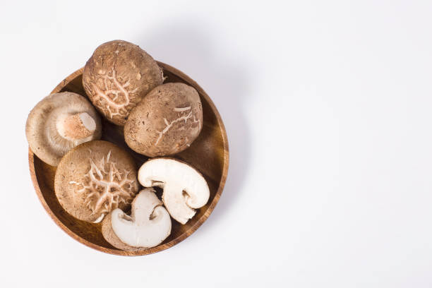 Fresh champignon mushrooms isolated on white. stock photo