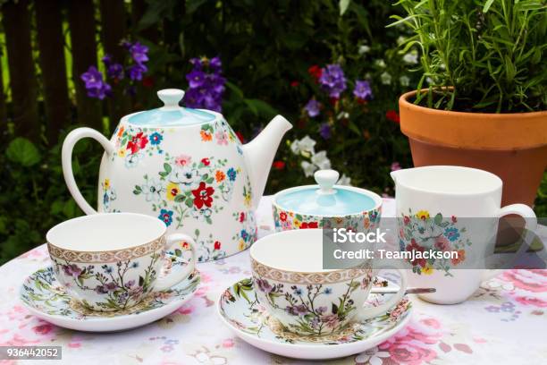Floral Tea Service On A Picnic Table Stock Photo - Download Image Now - Afternoon Tea, British Culture, Crockery
