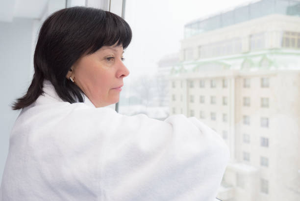 istock middle-aged woman by the window 936442102