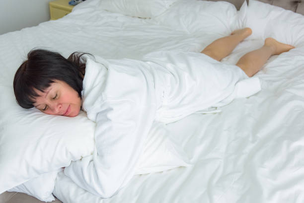 istock brunette woman in bed 936442242