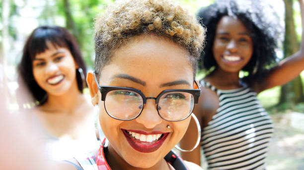 istock Multiracial group of friends taking selfie 936443780