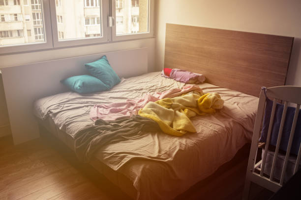 istock Untidy bed in the morning 936444560