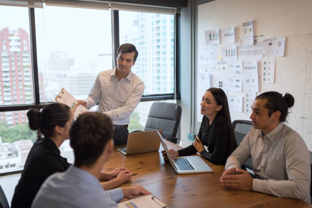 istock businessman crew working untill evening down light with new startup project. 936448788