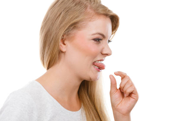 istock Woman having something disgusting on tongue 936451546