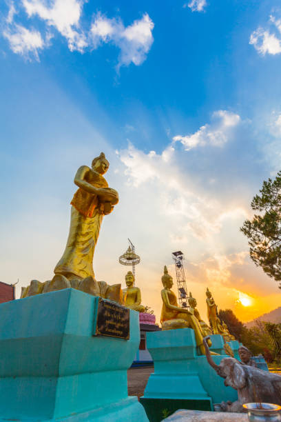istock scenery sunset behind the golden buddha statue 936460274