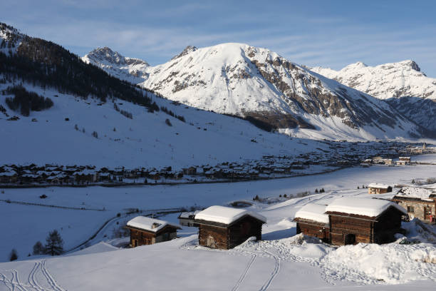 istock View across valley to chalets in deep snow 936461500