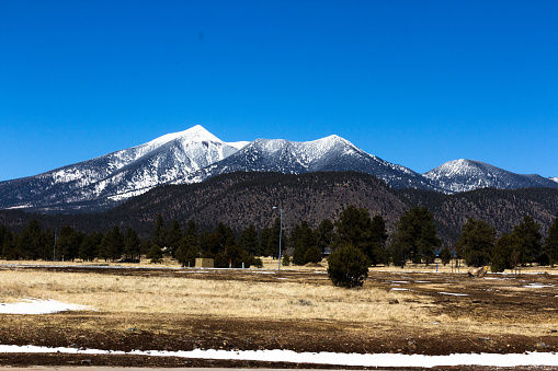 The San Francisco Peaks in the distance with a fresh powdering of snow in Flagstaff, Arizona