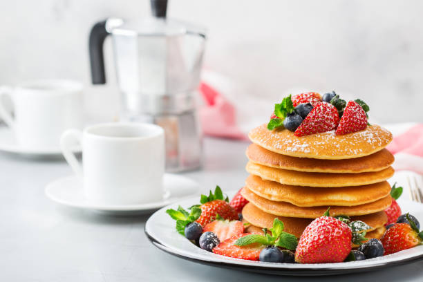 istock Stack of homemade pancakes for breakfast with berries 936464724