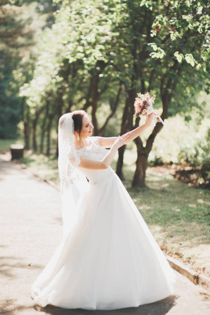 istock Bride holding big and beautiful wedding bouquet with flowers 936469768