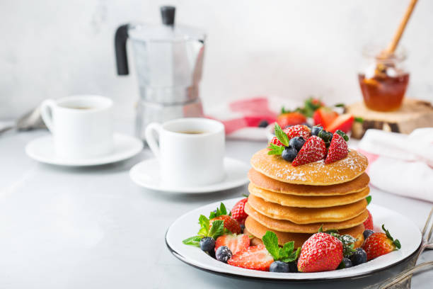 istock Stack of homemade pancakes for breakfast with berries 936472776