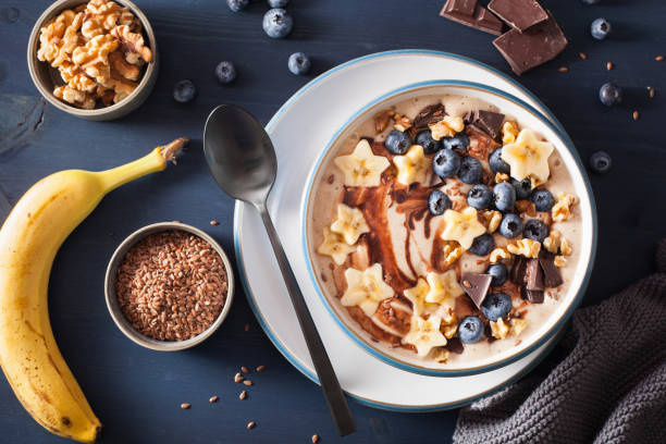 istock healthy banana smoothie bowl with blueberry chocolate walnuts 936473798