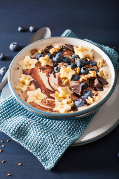 istock healthy banana smoothie bowl with blueberry chocolate walnuts 936474002