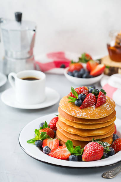 istock Stack of homemade pancakes for breakfast with berries 936474320