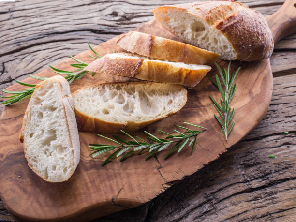 istock Slices of ciabatta with rosemary herb. 936476530