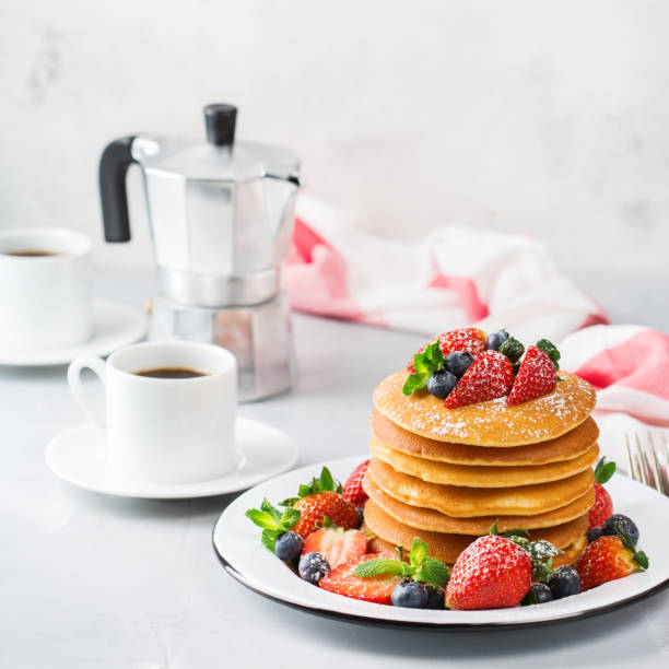 istock Stack of homemade pancakes for breakfast with berries 936477108