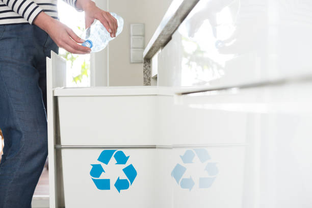 istock Aware housewife recycling plastic bottles 936477810