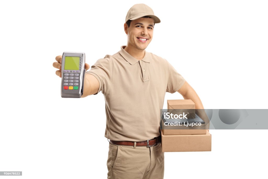 Delivery man holding a payment terminal and packages Delivery man holding a payment terminal and packages isolated on white background Credit Card Stock Photo