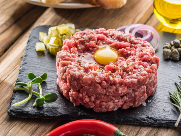 istock Steak tartare served with raw quail egg yolk. 936487882