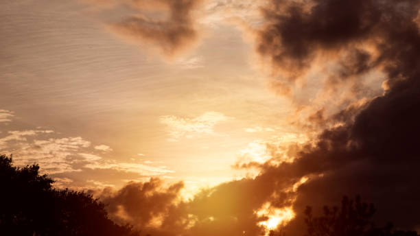 Sunset sky with clouds in vibrant hues.