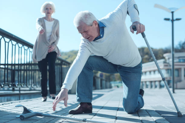 istock Senior man with crutches hitting the ground 936488528