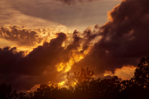 Sunset sky with clouds in vibrant hues.