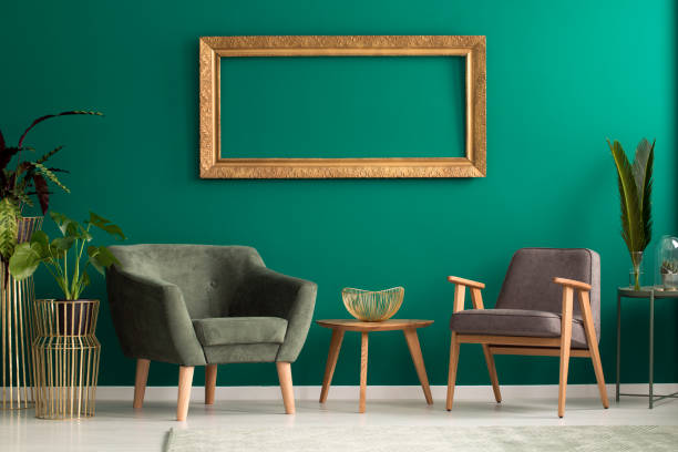 istock Retro armchairs in green living room 936491278