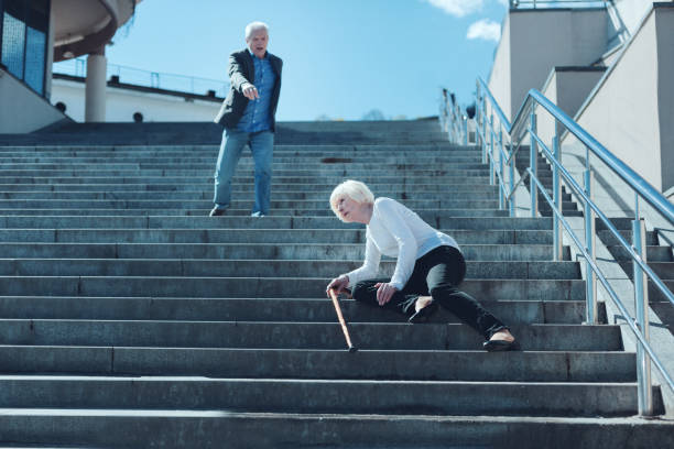 istock Scared man concerned about his wife falling on stairs 936491650
