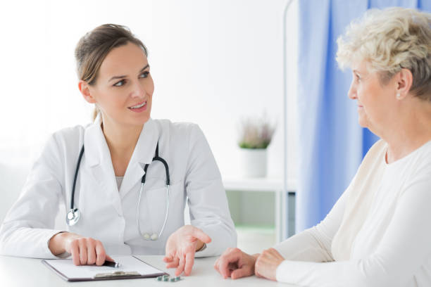 istock Professional doctor recommending pills 936493046