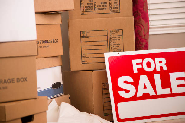 istock Cardboard moving boxes stacked in new home. 936495576