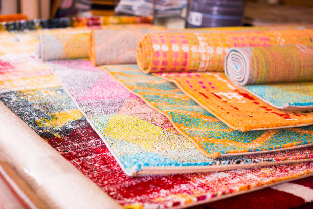 istock Various colorful wool rugs for sale at store 936496000