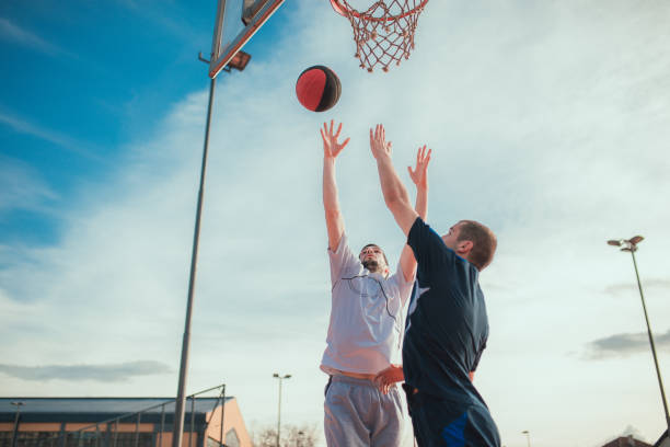 istock Two basketball players playing basketball 936496160