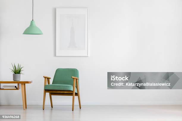 Retro Armchair In Bright Interior Stock Photo - Download Image Now - Sparse, Indoors, Wall - Building Feature